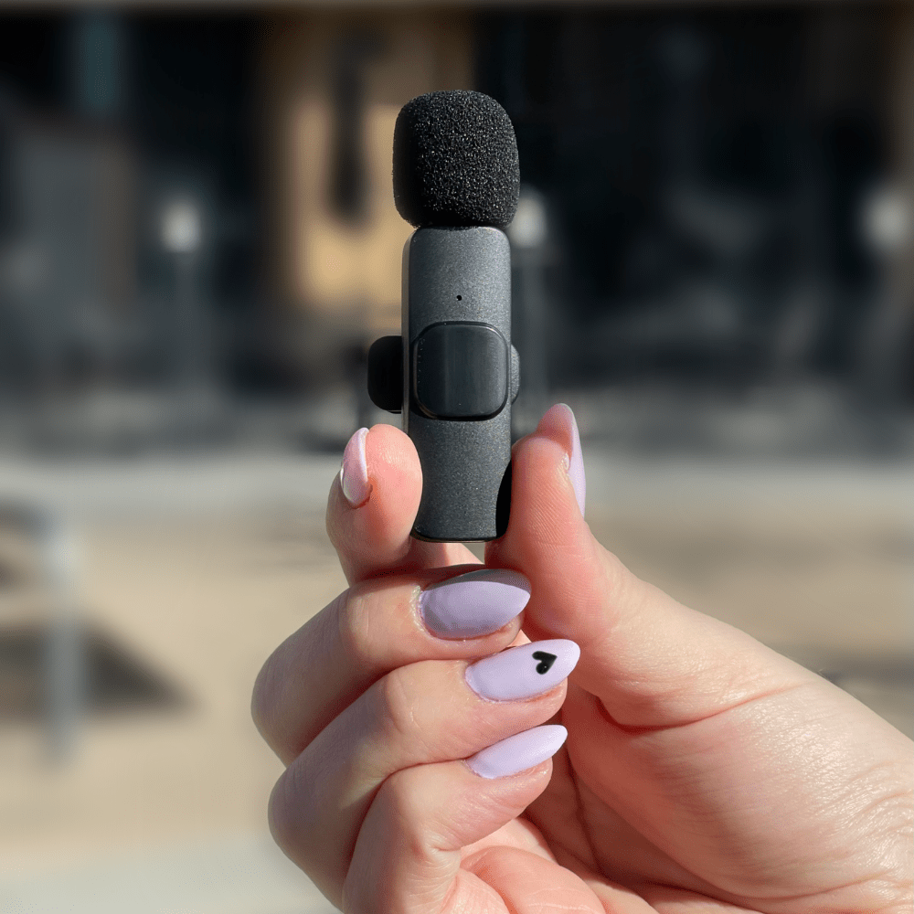 Magic Pop Mic (Black) Holding with fingers with purple nail polish